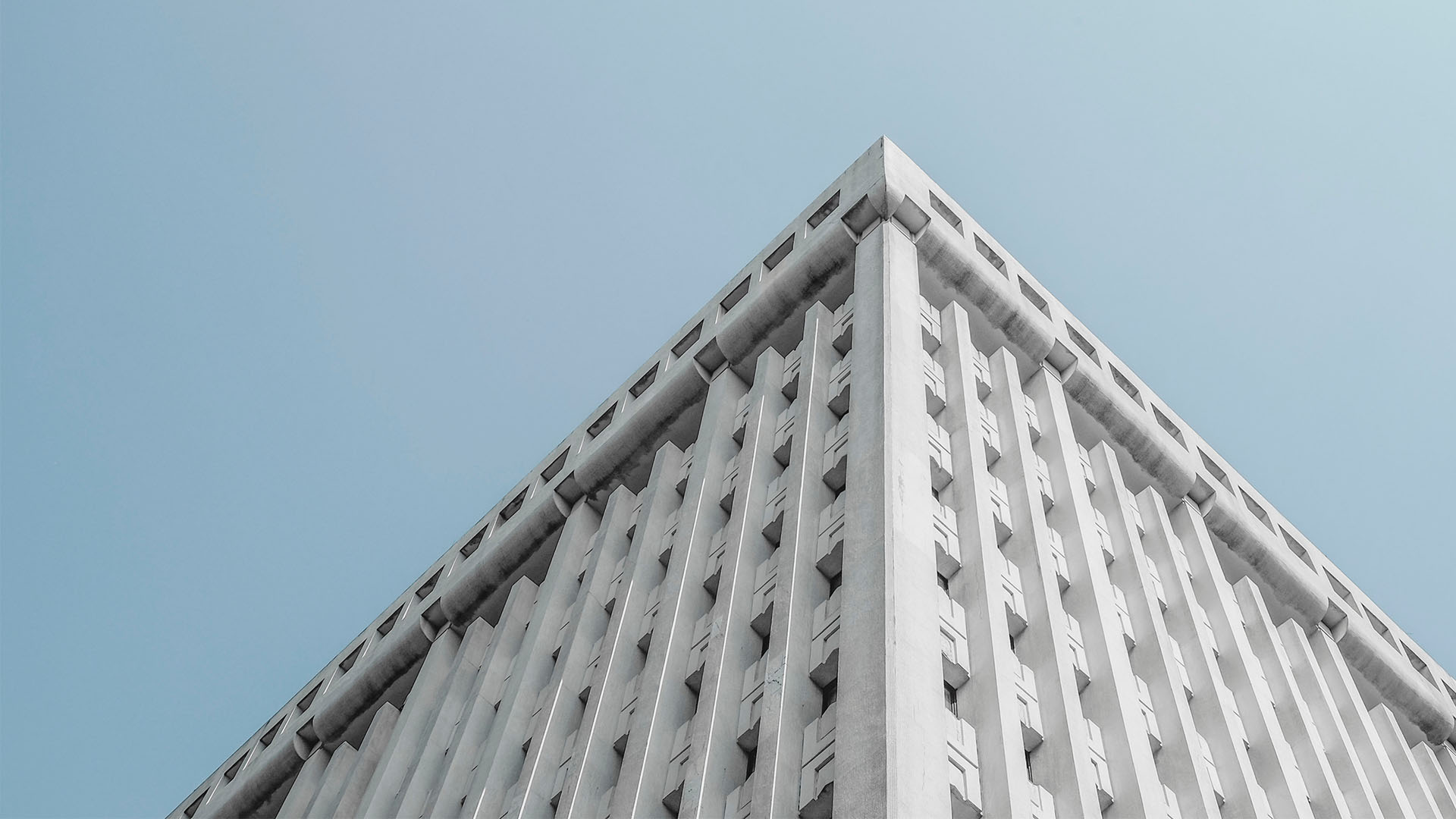 view of white office building from ground