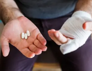 a man with a bandage on his hand