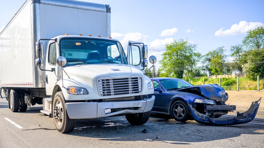Collision between semi truck and car on the highway