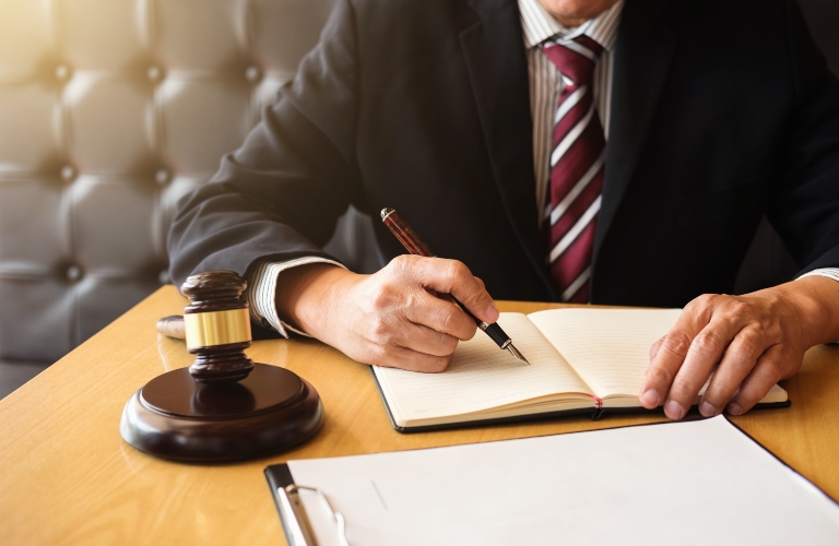Judge gavel and lawyer working on a documents