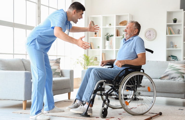 Senior man in wheelchair scared of angry nurse