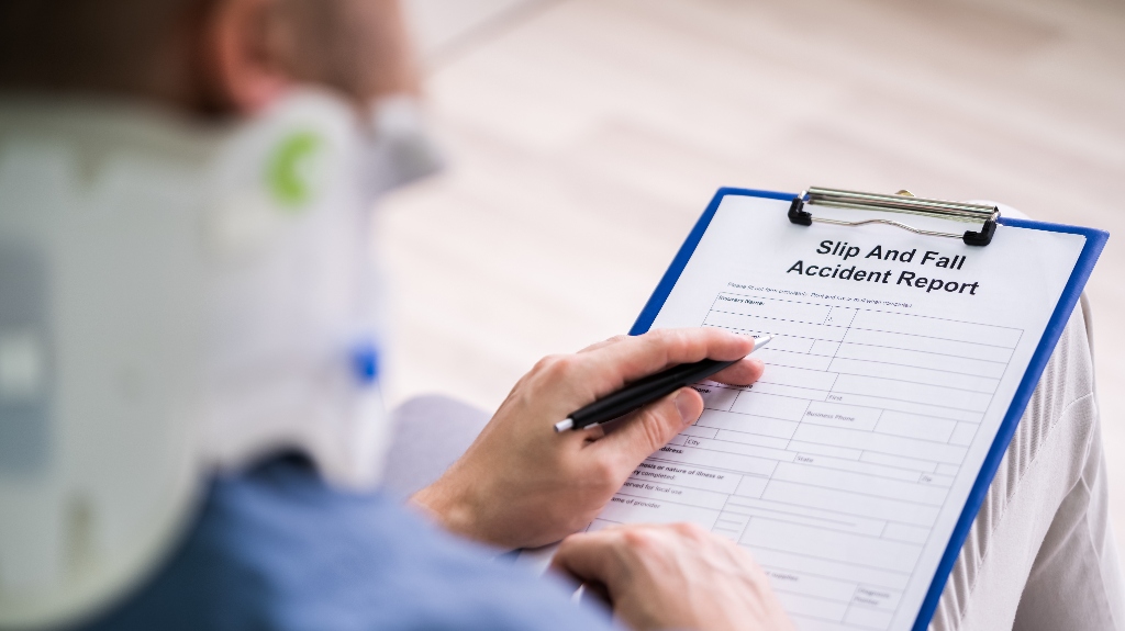 man is filling slip and fall accident report