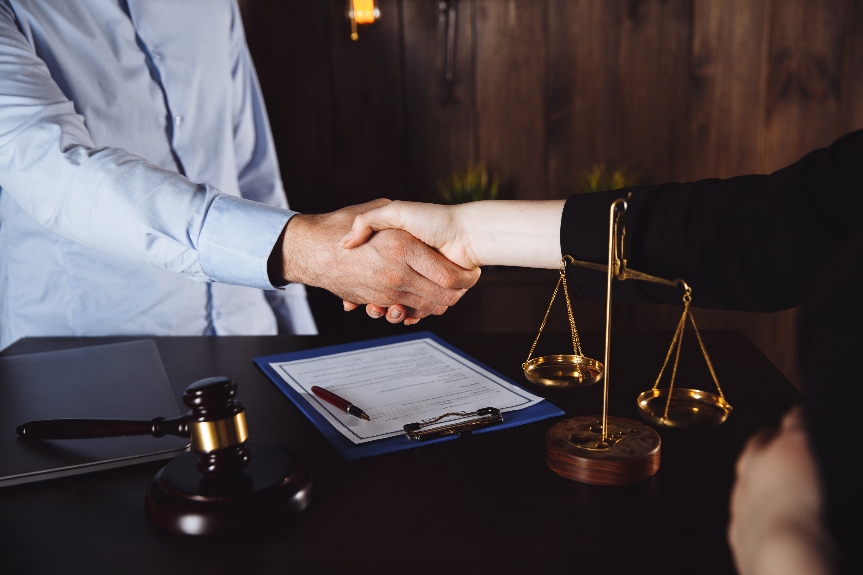 lawyer is shaking hand with client