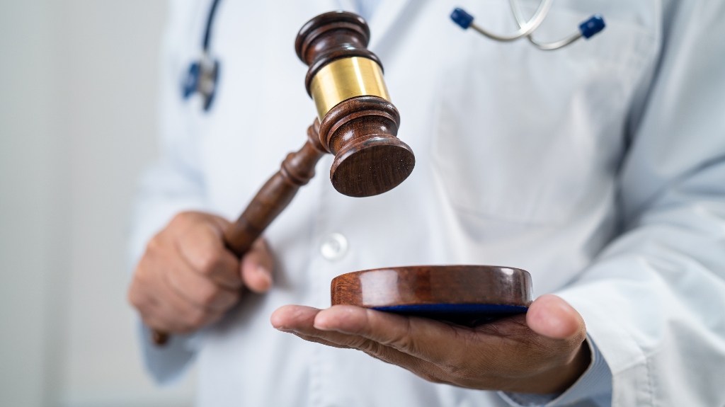 Doctor is holding judge's gavel